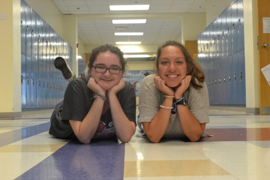 Lauren Snyder and Andrea Henriquez hanging out in the hallway.