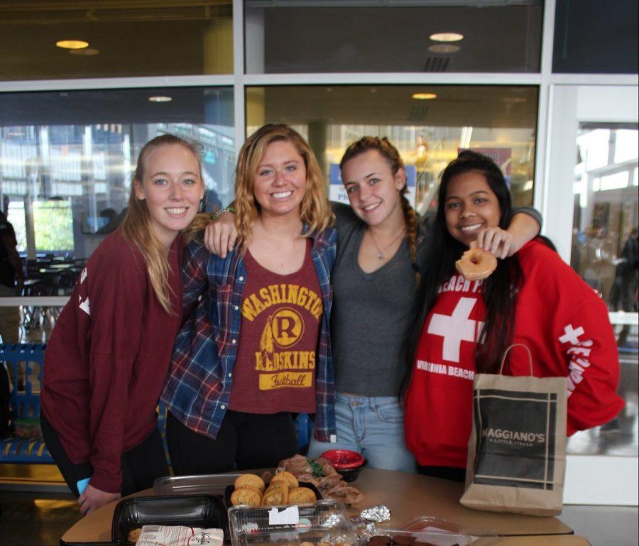 Kathleen+Columbia%2C+president+of+SASA+%28Students+Against+Sexual+Assault%29+helps+raise+money+through+a+food+drive