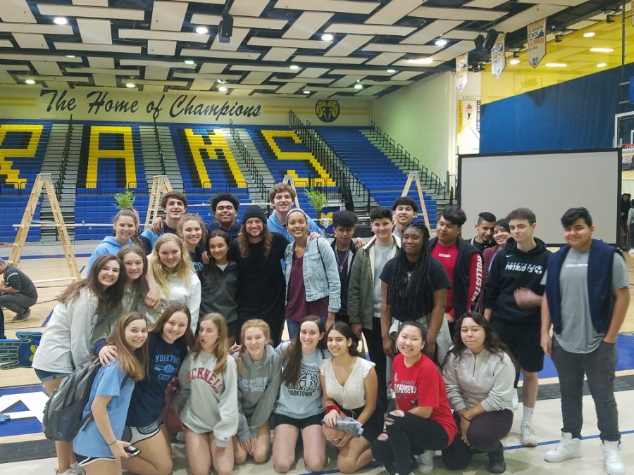 Students surround speaker, Mike Smith, at his conference