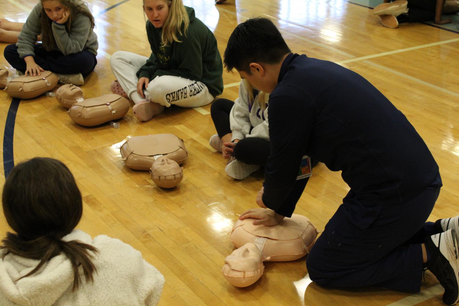 Instructors showed students how to properly perform CPR.