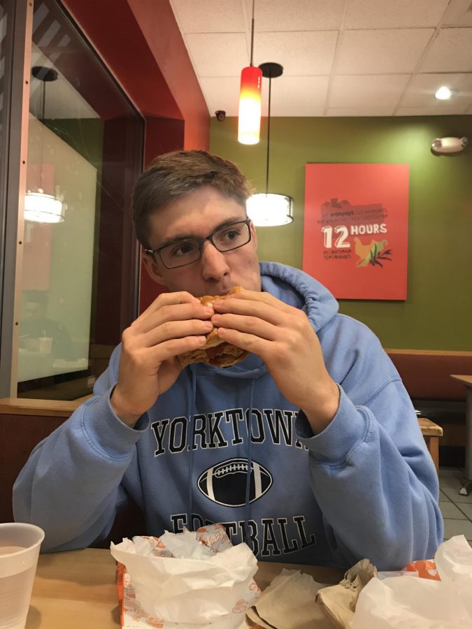 Sentry Staff Reporter Evan Rotker trying one of the chicken sandwiches in question. 