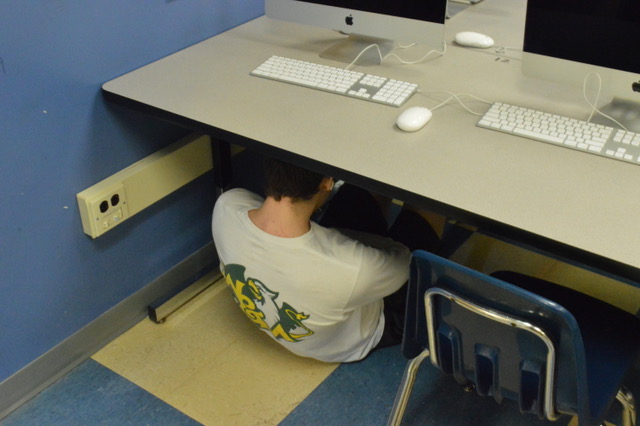 Kids during active shooter drills are forced to crouch under desks.