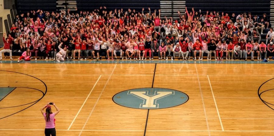 A Hype Squad Leader photographs the student section. 