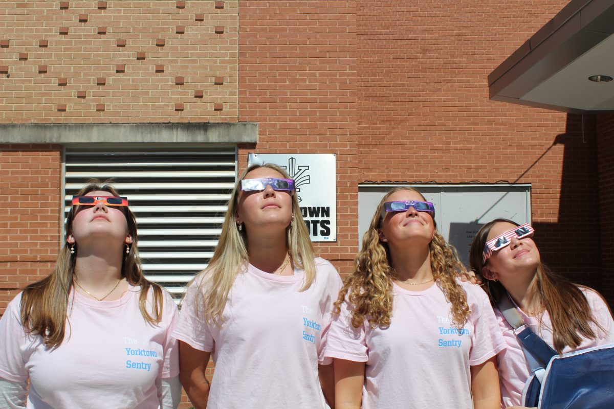 Students staring at Eclipse with Eclipse protection glasses.