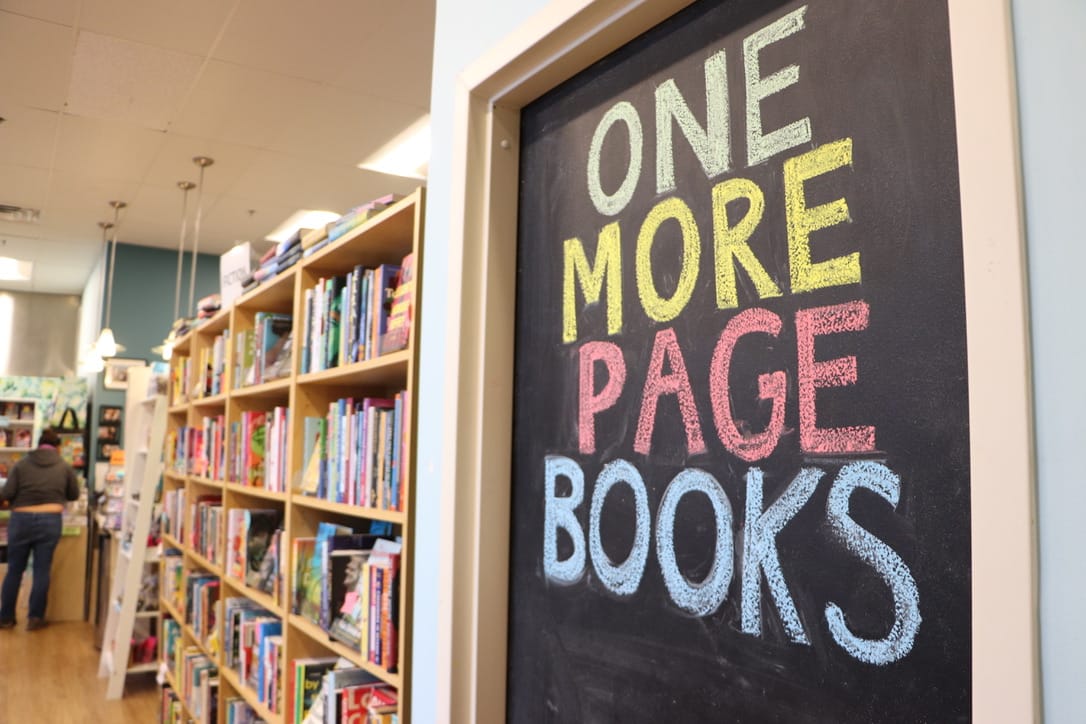 Customers have a selection of many shelves of books when they enter One More Page Books.